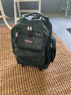 Cal pack Built-in bottom wheels and a top telescoping/retractable pull handle for rolling, plus a reinforced grab