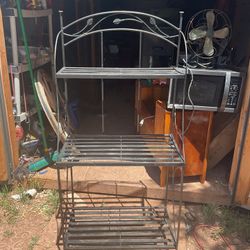A metal rack it’s 59 inches tall  28 inches wide and 16 inches deep