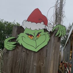 Christmas Grinch On Wood Fence 