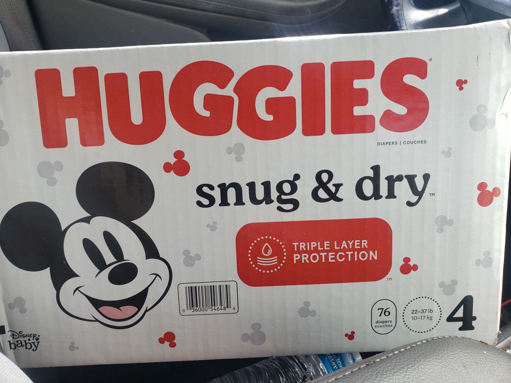 2 Boxes Of Huggies Size 4