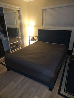 Queen size bed w/ mattress.