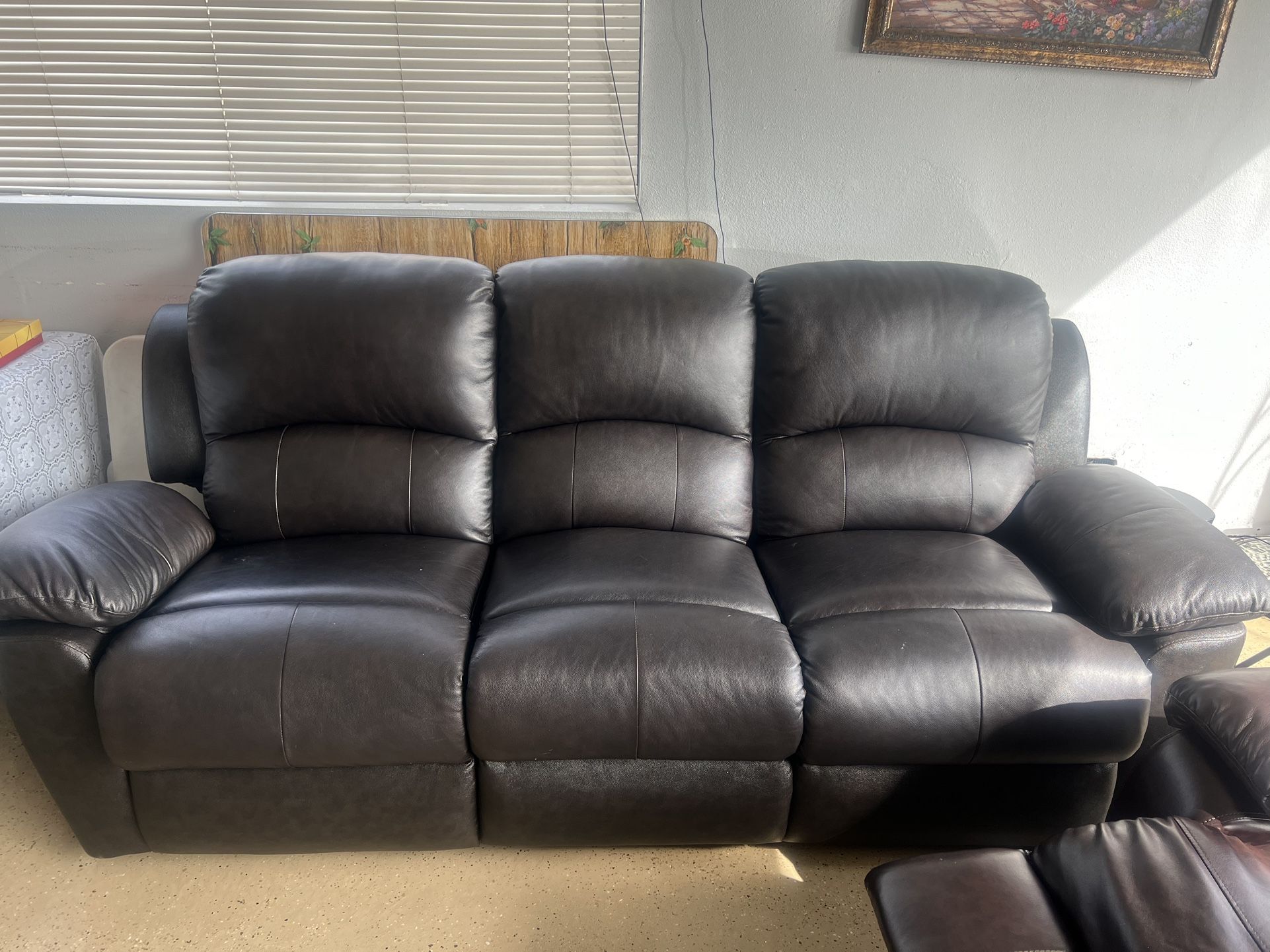 Two leather recliner sofa