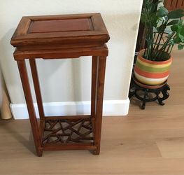 A vintage handmade all wood side table/plant stand