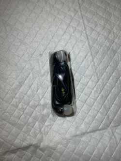 Black wired earbuds with gray silicone tips and a 3.5mm audio plug.