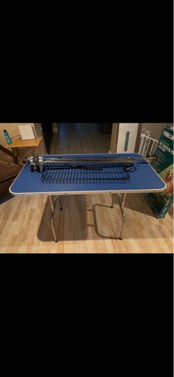 Dog grooming table