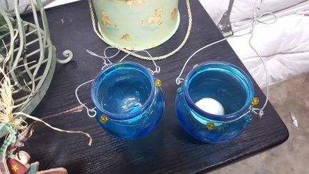 2 blue candle holders