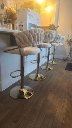 Gold bar stools with beige cushion
