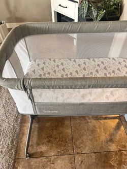 TC Bunny beside bassinet/sleeper