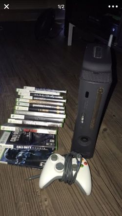 Xbox 360 with 14 games, 2 controllers and charge station