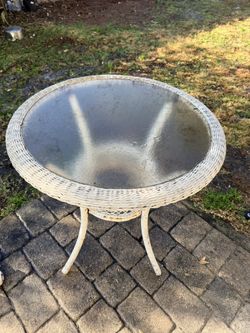 White wicker table has some rust