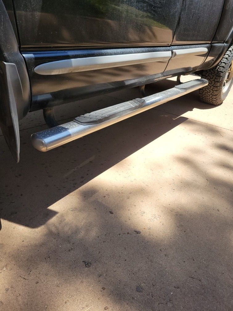 Dodge Ram steps and mud flaps.