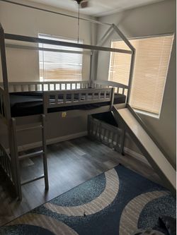 Bunk bed with ladder and slide