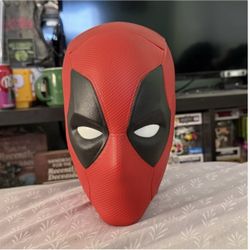 Deadpool and Wolverine head popcorn bucket.