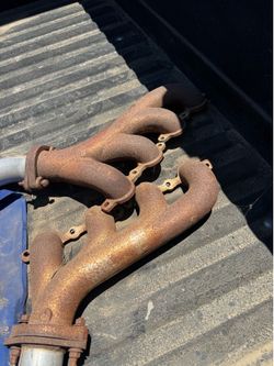 Chevy LS exhaust manifold. Under the rust is silver ceramic coat.