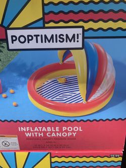 Inflatable pool with shade.