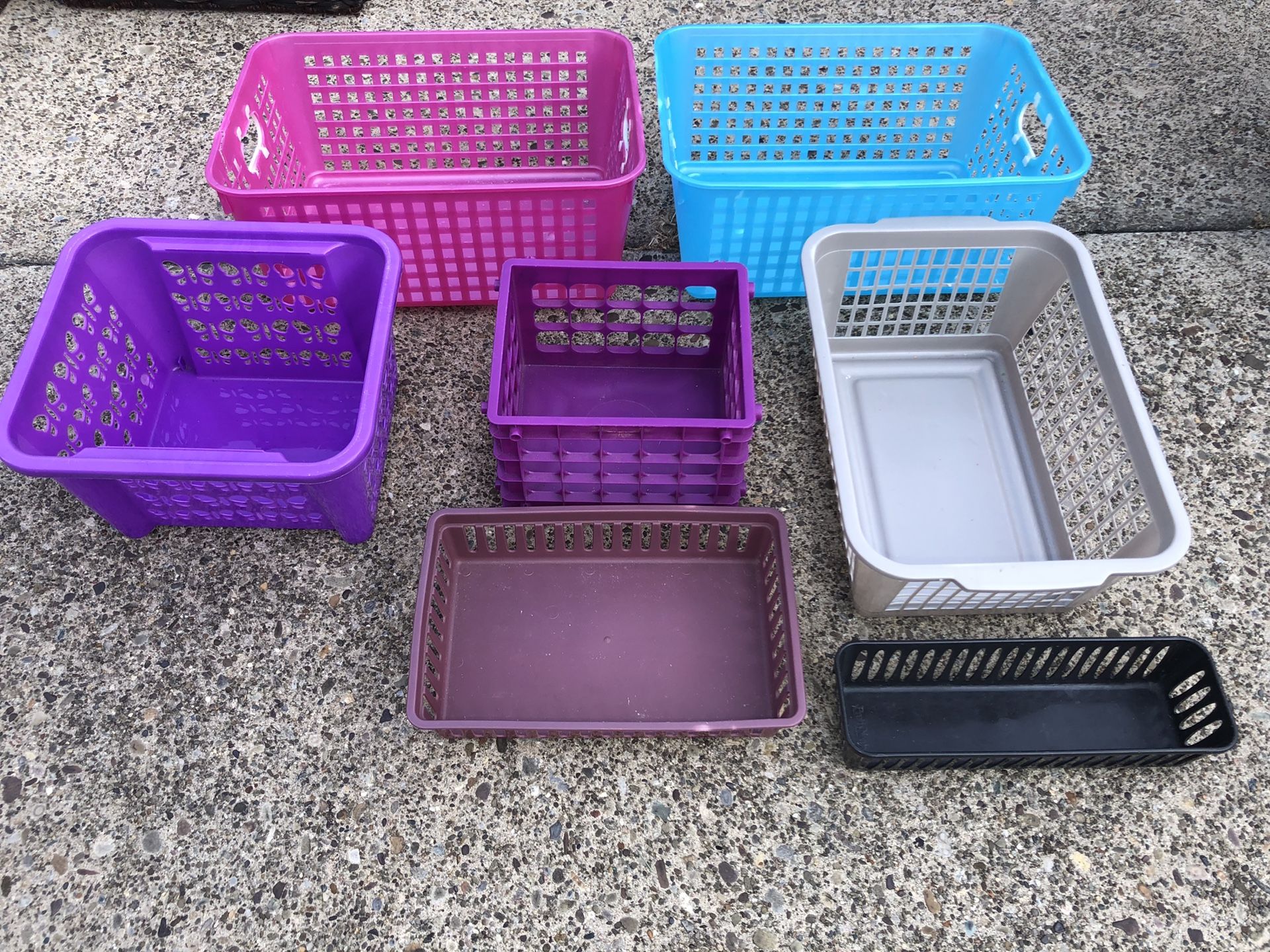 Several different plastic baskets