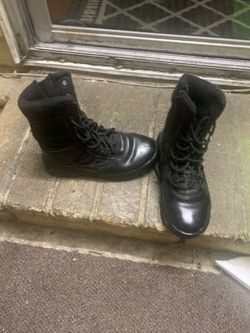 Black riding boot zips on side