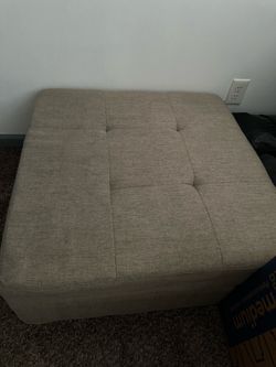 Tan ottoman with storage