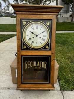 Emperor Clock Company wall mount, regulator chime display, note: no winding key, old clock may need repair.