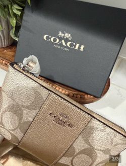 Coach metallic rose gold wristlet