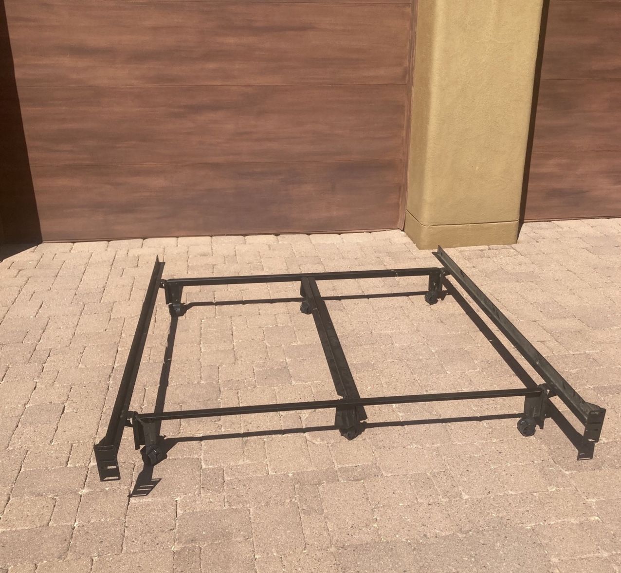 Queen Size Bed Frame With Wheels And Support In The Middle, Very Good Working Condition Nice And Clean