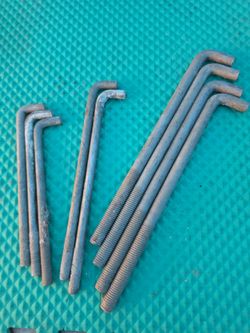 total of 9 heavy-duty L-anchor bolts (also commonly known as masonry anchors, foundation bolts, or J-bolts)