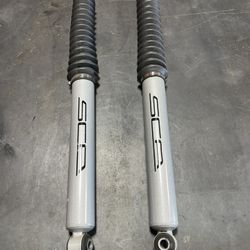 Two front SCA shocks off of a 2022 Ford F250 4wd with 5” lift
