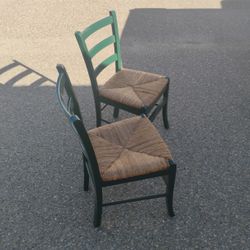2 Green Chairs. Wooven Seats