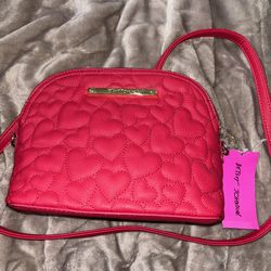 red purse with hearts