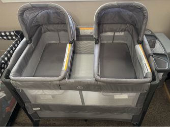 Twin bassinet/pack and play