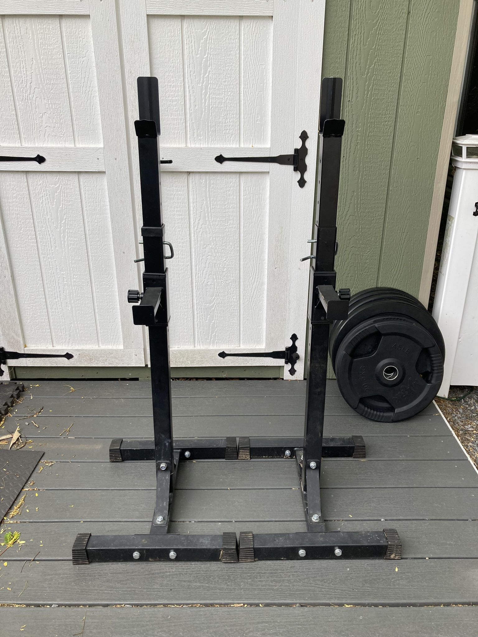 Pair Of Squat Stands And A Black 6’ Olympic Barbell