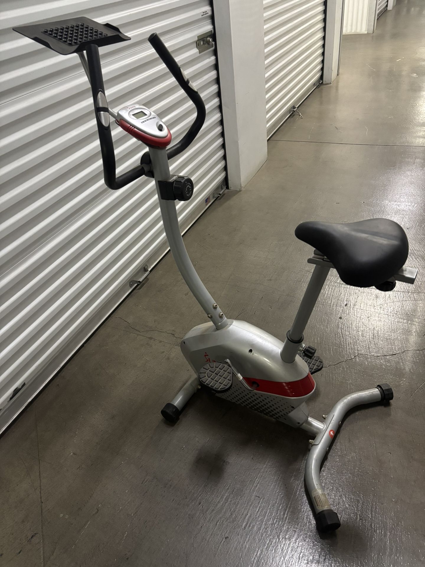 Exercise bike with digital display, and pulse reading.