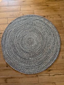 Round area rug- blue, black, off white colors