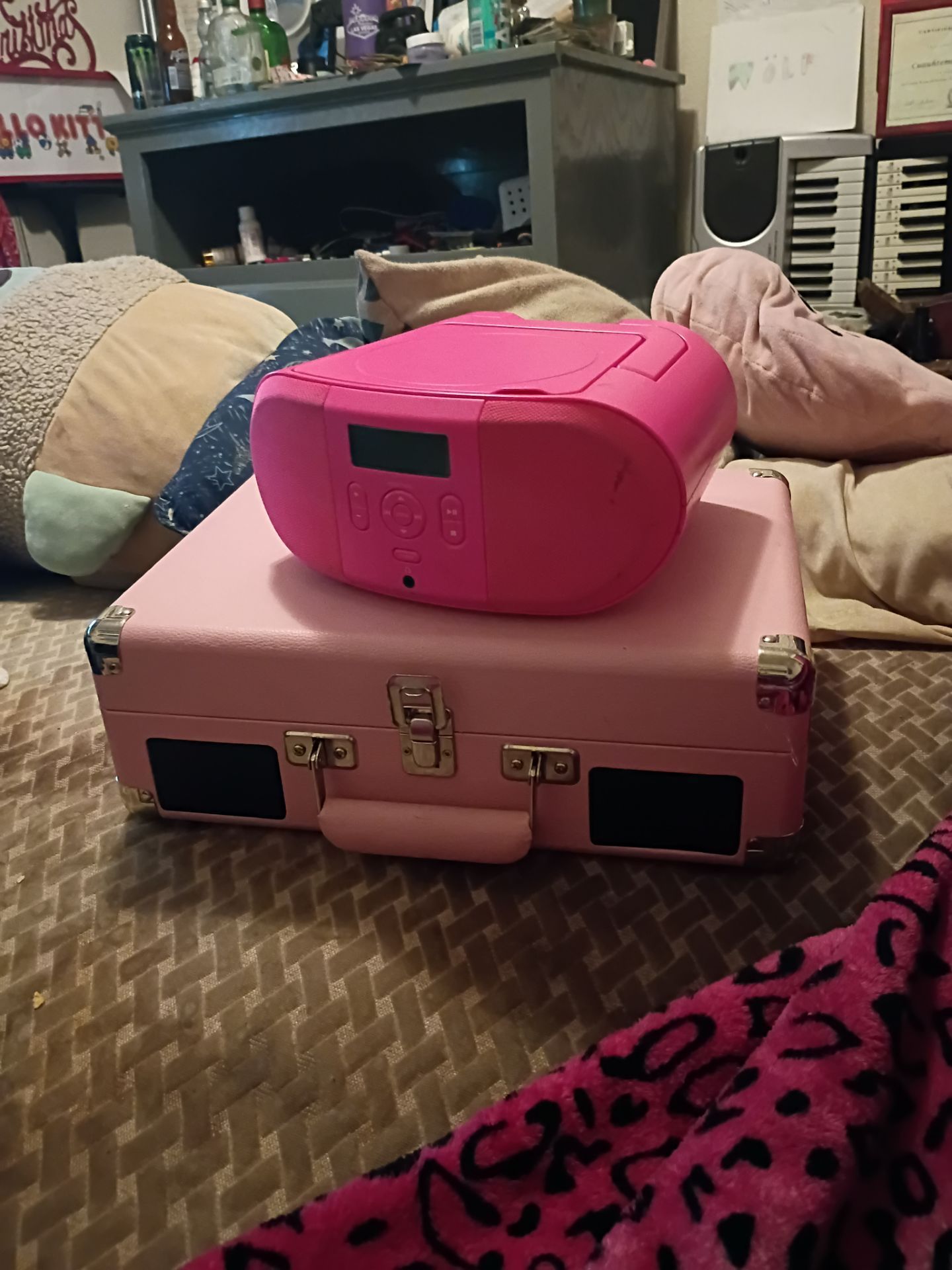 Pink Crosley Cruiser suitcase record player. And a portable ONN CD player