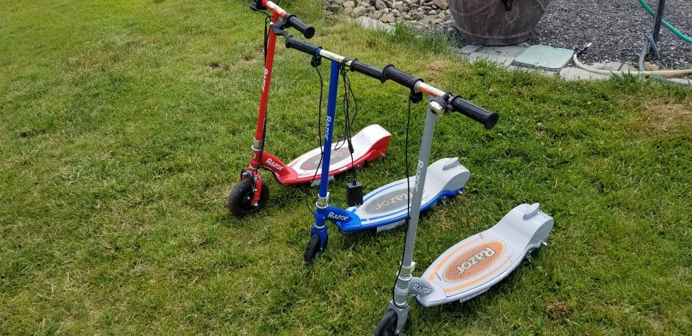 3 Electric Razor Scooters E100 Red,Orange,and Blue