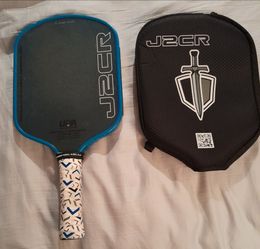 Honolulu J2CR Pickleball paddle with blue crystal grit. Hybrid shape