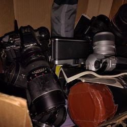 Several Boxes Of Old Film Cameras