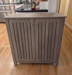 Gray Wood-Grain Storage Cabinet with Slatted Doors