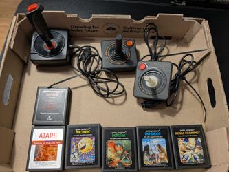 Vintage Atari video game cartridges and accessories. Pac Man