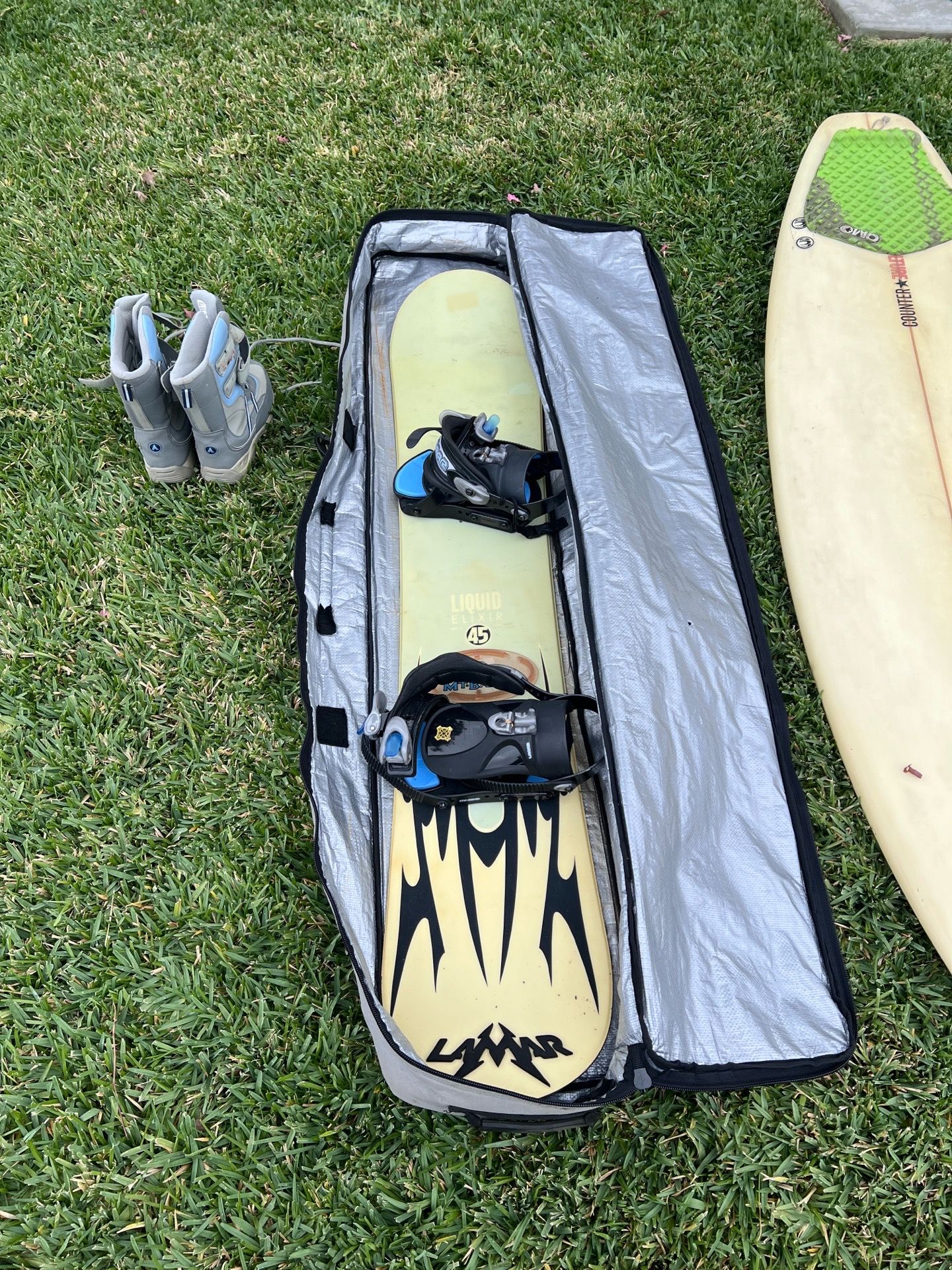 Snowboard, boots, and bag