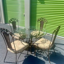 Vintage Heavy Wrought Iron table Set Table & 4 Chairs with round Beveled Glass Top