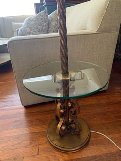 Late 20th Century floor lamp with a twisted column and glass shelf.