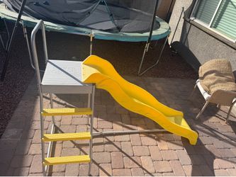 Slide attachment for trampolines
