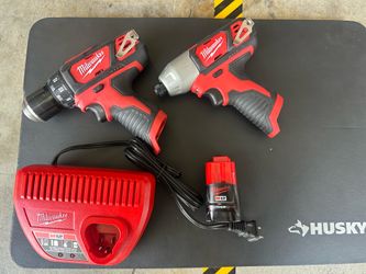 Milwaukee drill and impact driver with battery and charger
