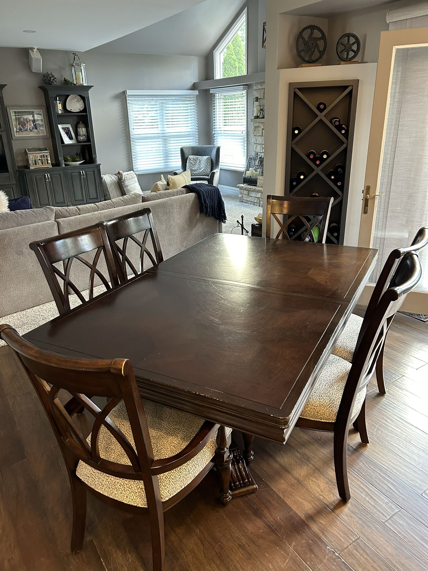 Kitchen table with six chairs and two counter heights stools