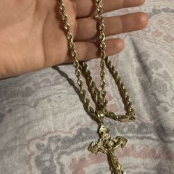 14K Gold chain with a cross pendant Of 14K .5MM 24 INCHES Long. 
