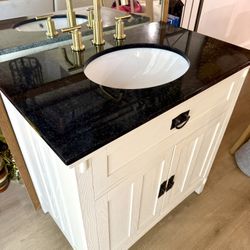 Single Vanity Sink with Black Marble Top Gold Faucet