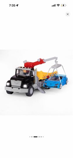 Driven by Battat toy tow truck