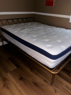 Full mattress and metal bedframe