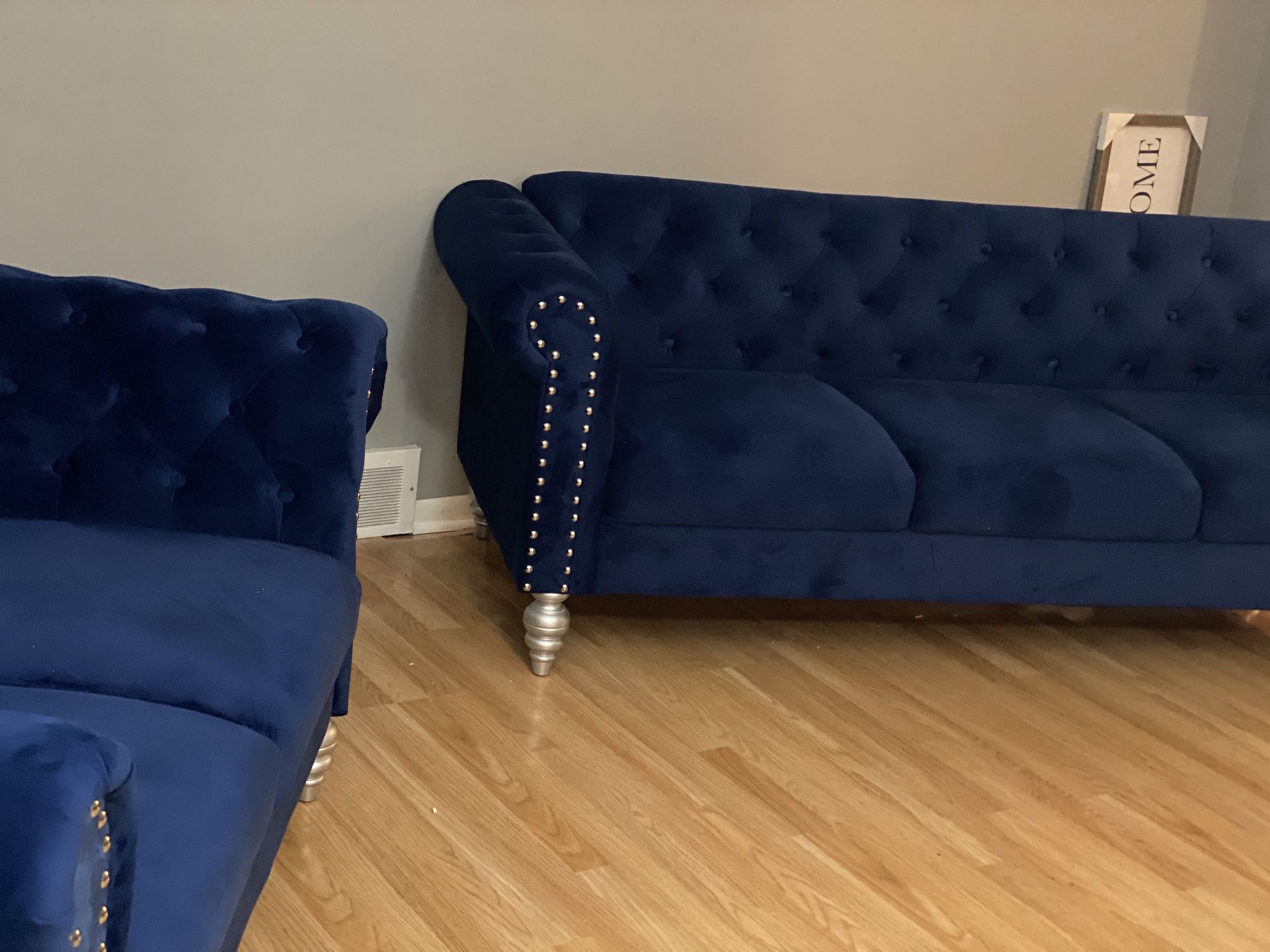 Navy blue chesterfield sofa and love seat from Wayfair